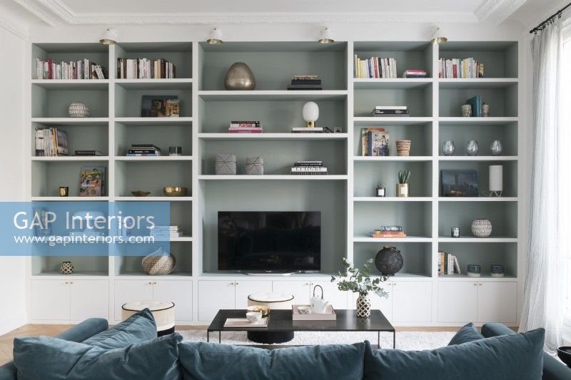 Full wall shelving unit in modern living room