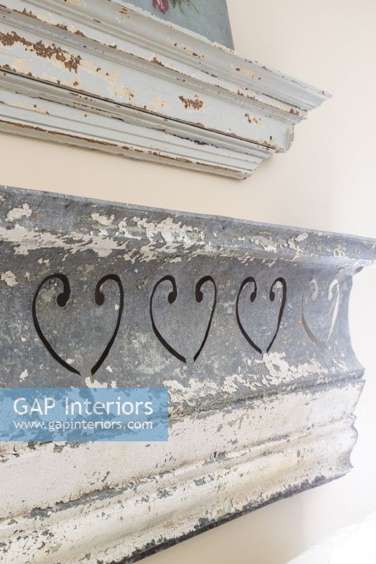 The weathered zinc header above the bed used to be part of an old building in nearby Greensboro,North Carolina.