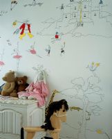 Chambre d'enfant avec une fresque murale dessinée