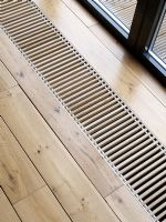 Détail du plancher en bois et de la ventilation