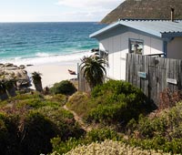 Maison en bois au bord de la mer, Afrique du Sud