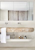 Salle de bain moderne avec lavabo en pierre